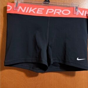 Nike Women's Black and Orange Pro Athletic Shorts